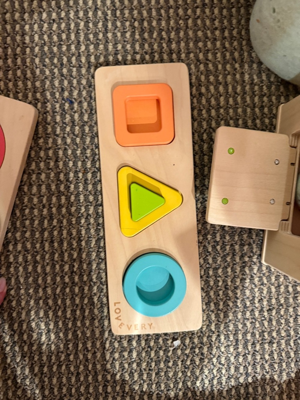 Lovevery Wooden Shape Sorting Board in Orange, Yellow, Green, Blue